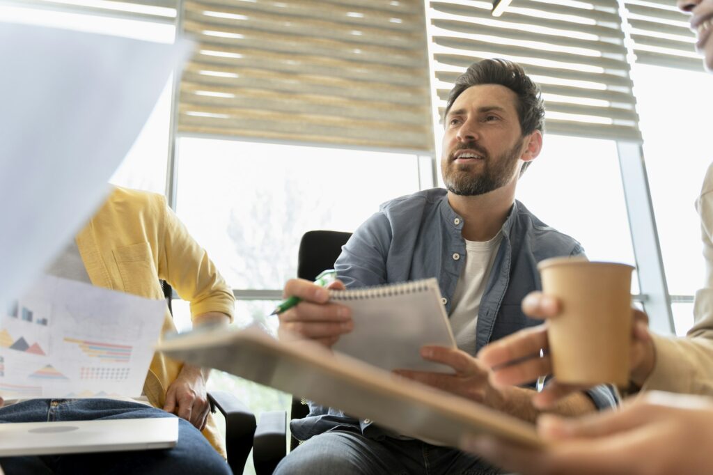 Confident portrait of a business coach, executive director CEO in a conference with his employees